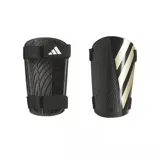 Canilleras de fútbol Adidas Tiro negras con detalles dorados y logo de la marca en blanco. Incluyen bandas elásticas ajustables con velcro.