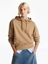 Buzo color beige de Tommy Hilfiger, de felpa de mezcla de algodón, con capucha con cordón, puños y bajo de punto canalé, hombros ligeramente caídos y logo bordado en el pecho.