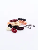 Pack de 12 coleros de tela en colores marrón, beige, bordó, negro, naranja y crema. Incluye coleros de tela lisa y coleros tipo resorte.