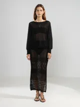 Sweater tejido en jersey con lurex, escote bote y detalle de tigre insignia de Polonio en la espalda.