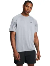 Remera deportiva Under Armour Tech 2.0 de hombre, color gris jaspeado con logo negro en el pecho.