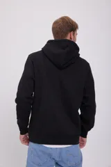 Canguro negro de manga larga con capucha, corte relajado y bolsillo tipo canguro. Estampado frontal con la inscripción "Originals Studio Brought to you by Jack&Jones Designed in Copenhagen".