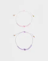 Set de dos pulseras de cordón ajustable con mostacillas de colores y dije de ojo turco.