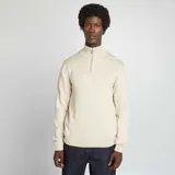 Sweater de punto color beige, con cremallera en el cuello y diseño clásico.