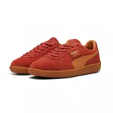 Championes Puma Palermo negros con detalles en blanco y suela color caramelo.