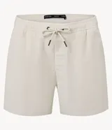 Bermuda de terciopelo color crema, corte runner, con cintura elástica, cordón ajustable y bolsillos laterales.