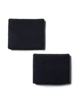 Par de muñequeras deportivas Under Armour negras con logo blanco bordado.