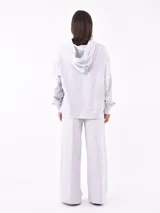 Hoodie de tejido de punto gris melange, con capucha y puños y ruedo acanalados.