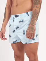 Bóxer de algodón con estampado floral en tonos azul y blanco, con cintura elástica y logo de la marca en el centro.