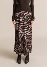 Falda midi de satén con estampado animal print de cebra en tonos marrones y beige.