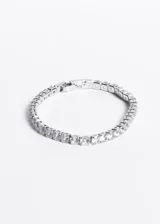 Pulsera tennis plateada de acero quirúrgico con zirconias blancas engarzadas.