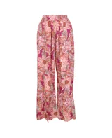 Pantalón palazzo con cintura elástica y estampado floral en tonos rosa, naranja y marrón.