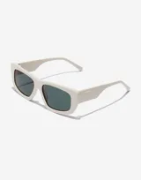 Lentes de sol Hawkers Zenith unisex, con montura cuadrada color crema y lentes color turquesa.