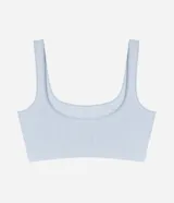 Soutien top negro de poliamida con acabado seamless, escote redondo y breteles anchos fijos.