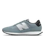 Championes New Balance modelo 237, color celeste con detalles en blanco y negro.