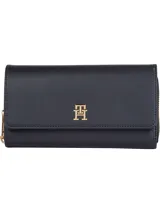 Billetera grande Tommy Hilfiger City, color negro, con cierre de solapa y cremallera. Incluye múltiples ranuras interiores para tarjetas y logo TH dorado en relieve.
