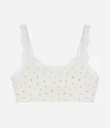 Soutien top blanco con estampado de flores pequeñas, breteles ajustables y detalle de encaje en el escote y los breteles.