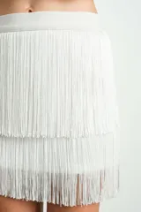 Minifalda elastizada blanca con elástico superior y dos capas de flecos.