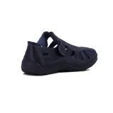 Guillerminas casuales de cuero sintético negro, con suela baja y ajuste con velcro.