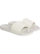 Ojotas Calvin Klein Jeans color blanco, con tira ancha de lona con logo CK en relieve y plantilla con logo de la marca.