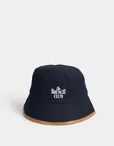 Piluso de denim azul con borde marrón y bordado frontal con la frase "The Brunch Club".