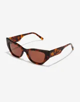 Gafas de sol Hawkers modelo Manhattan, unisex, con montura carey y lentes marrones.