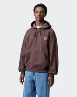 Sudadera con capucha Carhartt WIP modelo Vista Sweat, color marrón oscuro con efecto lavado (acid wash). Presenta un bolsillo canguro frontal y un pequeño parche con el logo de la marca en el pecho.