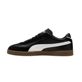 Championes Puma Club LI Era de cuero sintético negro con detalles en amarillo y suela color caramelo.