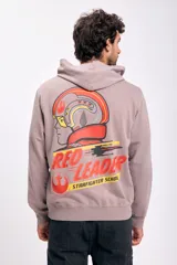 Canguro deportivo color beige con capucha y estampado en la espalda de un casco de piloto de Star Wars y la leyenda "Red Leader Starfighter School".