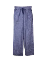 Pantalón largo de tiro alto con corte relajado, estampado a cuadros azules y blancos, cierre con cordón y bolsillos laterales.