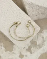Brazalete rígido abierto de bronce con forma de herradura.