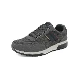 Zapatillas deportivas urbanas negras con detalles en gris y marrón. Presentan cordones y suela de goma blanca y negra.