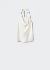 Top color blanco con estampado de lunares, de tejido jacquard satinado, con cuello drapeado y espalda descubierta con cierre de lazo.