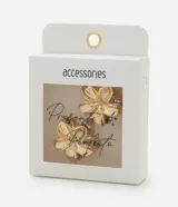 Kit de dos pinzas para el pelo con forma de flor dorada.