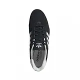 Zapatillas Adidas Adi Racer Lo negras con detalles plateados y las tres tiras blancas clásicas de la marca.