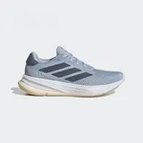 Championes de running Adidas Supernova Ease, color celeste con detalles en azul marino y blanco.