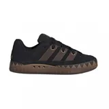 Zapatillas Adidas Adimatic negras con detalles en marrón.