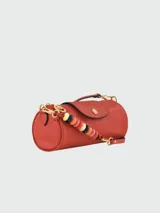 Bandolera Longchamp modelo Le Pliage Xtra, tamaño S, color terracota, con correa de cuero ajustable y cierre con botón a presión.