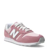 Championes New Balance modelo 373 para mujer, color rosado (rosa viejo/dusty rose) con detalles en gris claro y blanco. Presentan una combinación de gamuza y malla, con el logo 'N' en blanco y entresuela blanca con suela exterior gris.