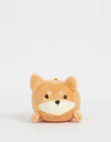 Llavero de peluche con forma de perro Shiba Inu color naranja con detalles en blanco y negro.