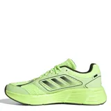 Championes Adidas color verde flúor con detalles en negro y suela blanca.