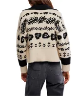 Cárdigan de tejido de punto grueso, color marrón oscuro con estampado jacquard en blanco de motivos florales y náuticos. Presenta cuello camisero y cierre frontal de botones.