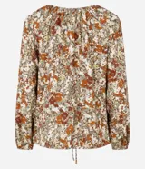 Blusa de manga larga confeccionada en viscosa con cuello redondo, lazo en el escote, abertura debajo del escote y estampado abstracto.