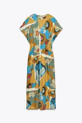 Vestido midi de algodón con estampado floral multicolor, cuello redondo, manga corta caída y pliegues en la cintura.