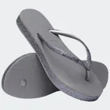 Ojotas Havaianas Slim Flatform Sparkle negras con plataforma y tiras finas con glitter.