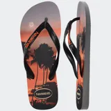 Ojotas Havaianas Top Surfer I con base blanca y estampado de paisaje marino. Tiras blancas con logo de la marca.