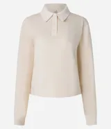 Suéter color crema de algodón y poliéster, con cuello polo, manga larga ajustada y abotonado delantero.