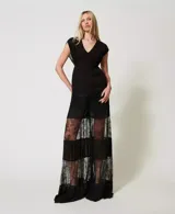 Pantalón palazzo de georgette negro con inserciones de encaje plisado, cintura alta con elástico y placa con el logotipo Oval T en la parte trasera.