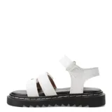 Sandalias blancas con plataforma negra y tiras con apliques de flores.