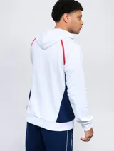 Canguro hoodie azul con capucha, cordones ajustables, bolsillo canguro y detalles en blanco y rojo en los costados y mangas. Incluye el logo de Umbro y el escudo del Club Nacional de Football en el pecho.